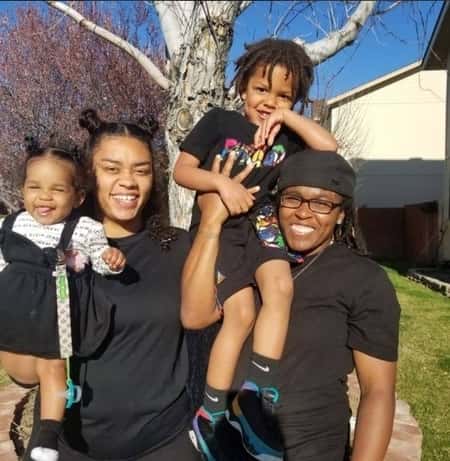 Jasmine Plummer and her wife with two children 